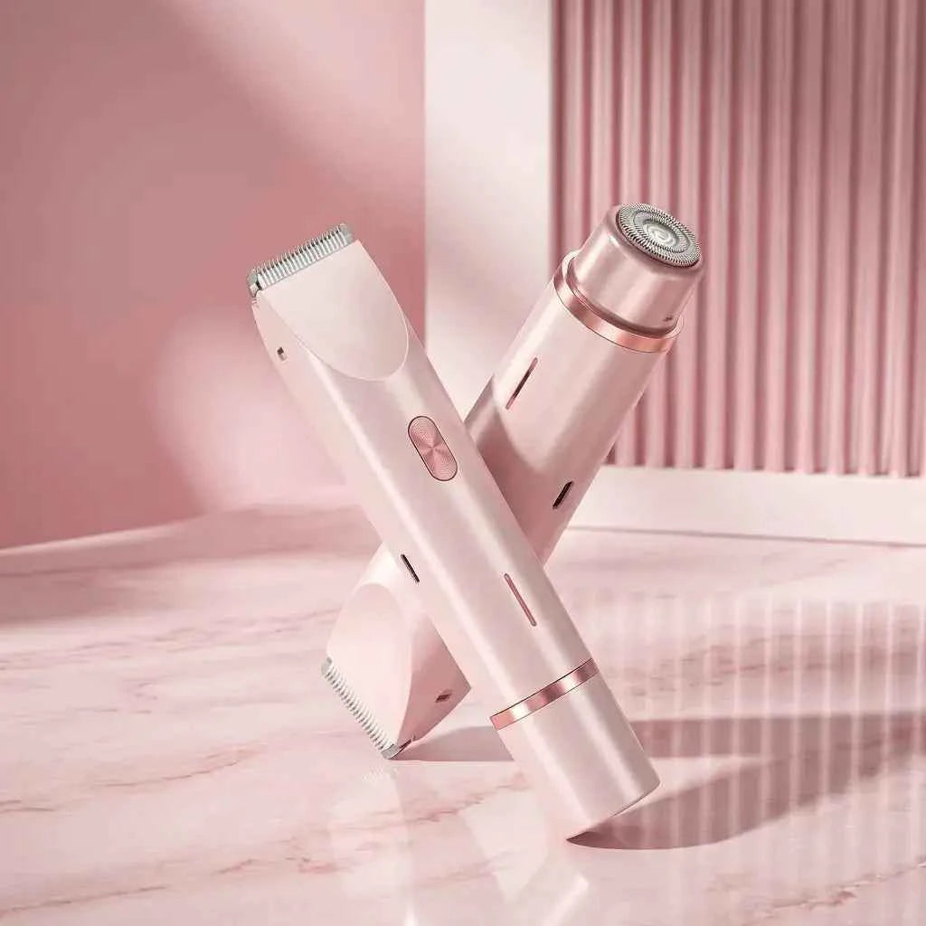 Pink dual-head electric lady shaver with rotary shaver head and trimmer blade crossed on marble surface