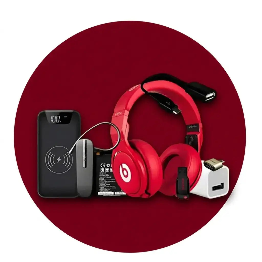 Red headphones with charging cable and power bank on a red background